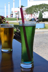 two cold beers in a glass on the table of a restaurant