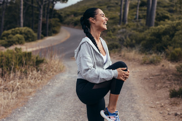 Fitness woman warming up before a run