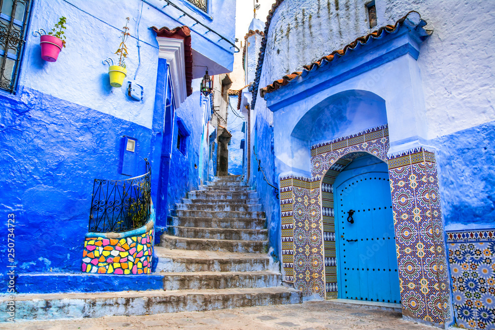 Amazing view of the street in the blue city of Chefchaouen. Location: Chefchaouen, Morocco, Africa. Artistic picture. Beauty world - obrazy, fototapety, plakaty 