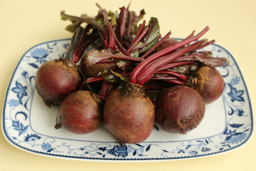 Wall Mural - A bunch of red beetroot on a plate