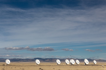 Wall Mural - very large array line of radio antenna dishes in the winter desert, space science and technology, ho