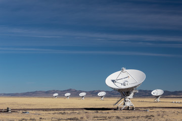 Wall Mural - very large array of radio astronomy observatory dishes in winter, science and technology, horizontal