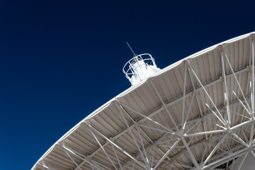 Wall Mural - very large array radio telescope dish pointing into a deep blue sky, science technology, horizontal 