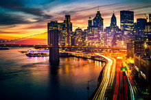 Must See When Visiting New York City. View Of Lower Manhattan And  Brooklyn At Sunset. Night Scene. Light Trails. City Lights. Urban Living, Travel, Real Estate  And Transportation Concept