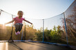 © Martinan - Little adorable girl playing on trampoline
