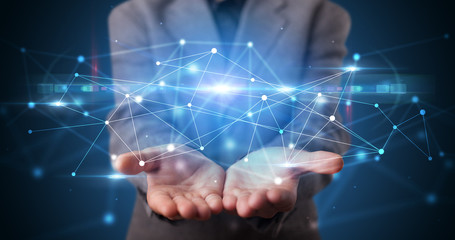 Poster - Handsome person holding hologram screen displaying modern cloud based web system technology
