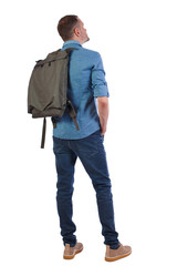 Back view of a man with a green bag.