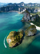 Aerial view of green rocky cliffs and boats on Phra Nang beach bay, Railay beach, in Krabi Province, coastline in Phuket, Thailand. James Bond Island.