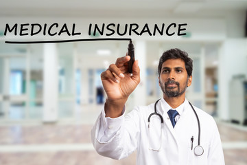 Wall Mural - Medic underlining medical insurance text on screen.