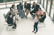 © InfiniteFlow - Businesswomen and businessmen in group meeting.