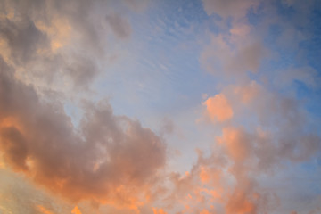 Wall Mural - Red cloud and blue sky background. Dramatic sunset sky began to change from blue to orange.