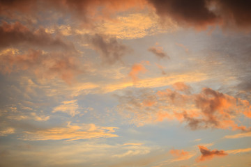 Wall Mural - Red cloud and blue sky background. Dramatic sunset sky began to change from blue to orange.