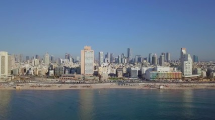 Wall Mural - Tel aviv, Israel - Aerial footage of the city's skyline and crowded beach on a summer's day