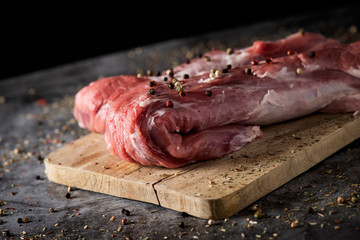 Wall Mural - piece of pork tenderloin on. a chopping board