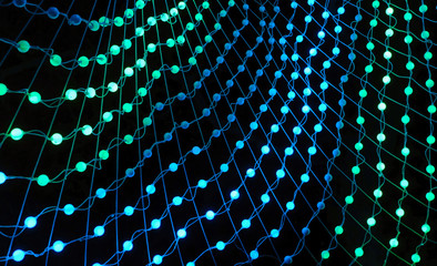 Wall Mural - Colorful lights in a circle shaped net