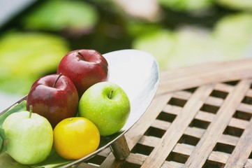 Thai exotic tropical fruits in luxury silver basket, welcome fruit basket in hotel