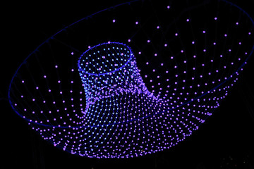 Wall Mural - Colorful lights in a circle shaped net