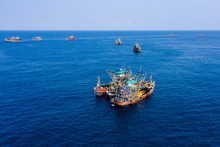 Overfishing - Aerial View Of A Large Fleet Of Fishing Trawlers Working Together In A Small Area Of The Andaman Sea