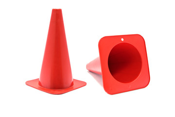 Road cone signal. Red plastic cone with reflective stripes isolated on white background.