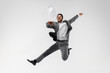 © master1305 - Happy businessman dancing in motion isolated on white studio background. Flexibility and grace in business. Human emotions concept. Office, success, professional, happiness, expression concepts