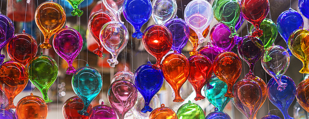 beautiful colorful murano glass balls handmade in Venice, Italy. Colorful balloons made of Venetian Murano Glass. Traditional carnival in Venice, selective focus - obrazy, fototapety, plakaty 
