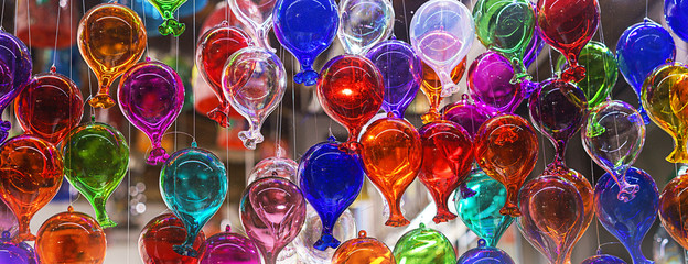 beautiful colorful murano glass balls handmade in Venice, Italy. Colorful balloons made of Venetian Murano Glass. Traditional carnival in Venice, selective focus