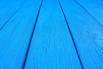 Blue wooden boards. Close-up. Vertical view from the bottom to the top. Background. Texture.