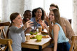 © fizkes - Happy multiracial friends making funny selfie photo, recording video