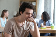 © fizkes - Upset thoughtful man sitting alone, low self-esteem, have no friends