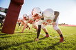 © Cavan Images - Teenage football players (14-15, 16-17) tackling in school field