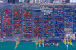 Aerial view to a lot of intermodal shipping container are in a port. cargo transportation system on ships. Graphic view of multi-colored containers on top.