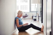 Senior Woman Using Laptop At Home 