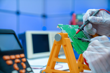 Sticker - Fixing electronics PCB board in service /  workbench with electronics measuring instruments