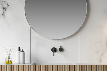 Close up of white marble bathroom with sink