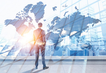 Poster - Businessman looking at world map in city sky