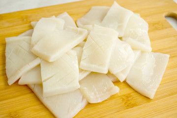 Raw Squid on a Bamboo Cutting Board