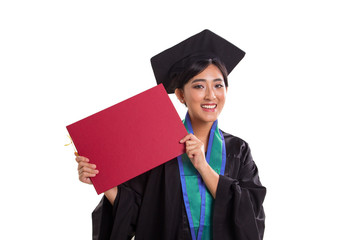 Young female bachelor showing her graduation certificate closeup