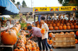 © Cavan Images - Couple by pumpkin stand