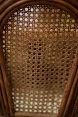 Wicker furniture. Summer terrace of the restaurant. Decor. Texture of wicker furniture. Weaving of vines. Garden furniture. Furniture made of natural material.