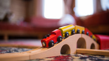Toy Wooden Train And Railway On The Carpet In The Child's Room