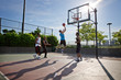 © Cavan Images - Men playing basketball