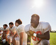 © Cavan Images - High school football players (16-17) in line