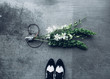 © Cavan Images - Shoes and bunch of flowers