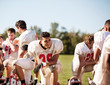 © Cavan Images - Teenage football players (16-17) taking break at football practice