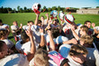 © Cavan Images - Teenage football team (14-15, 16-17) cheering after game