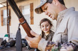 © Cavan Images - Father and daughter (6-7) looking at hunting rifle