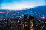 Fototapeta Miasto - 5G network wireless systems and internet of things with modern city skyline