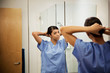 © Cavan Images - Young Nursing Student Getting Ready for Clinicals
