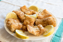 Breaded And Fried Salted Cod With Lemon