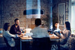 © Cavan Images - Five people sitting in office during meeting